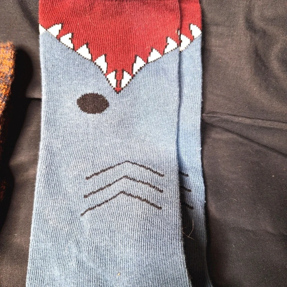 Women's one pair‎ of Mukluks Over the knee socks and on pair of Shark bite socks